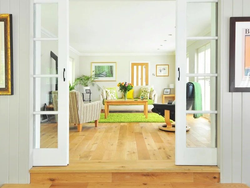 Living room and entryway with hardwood flooring installed